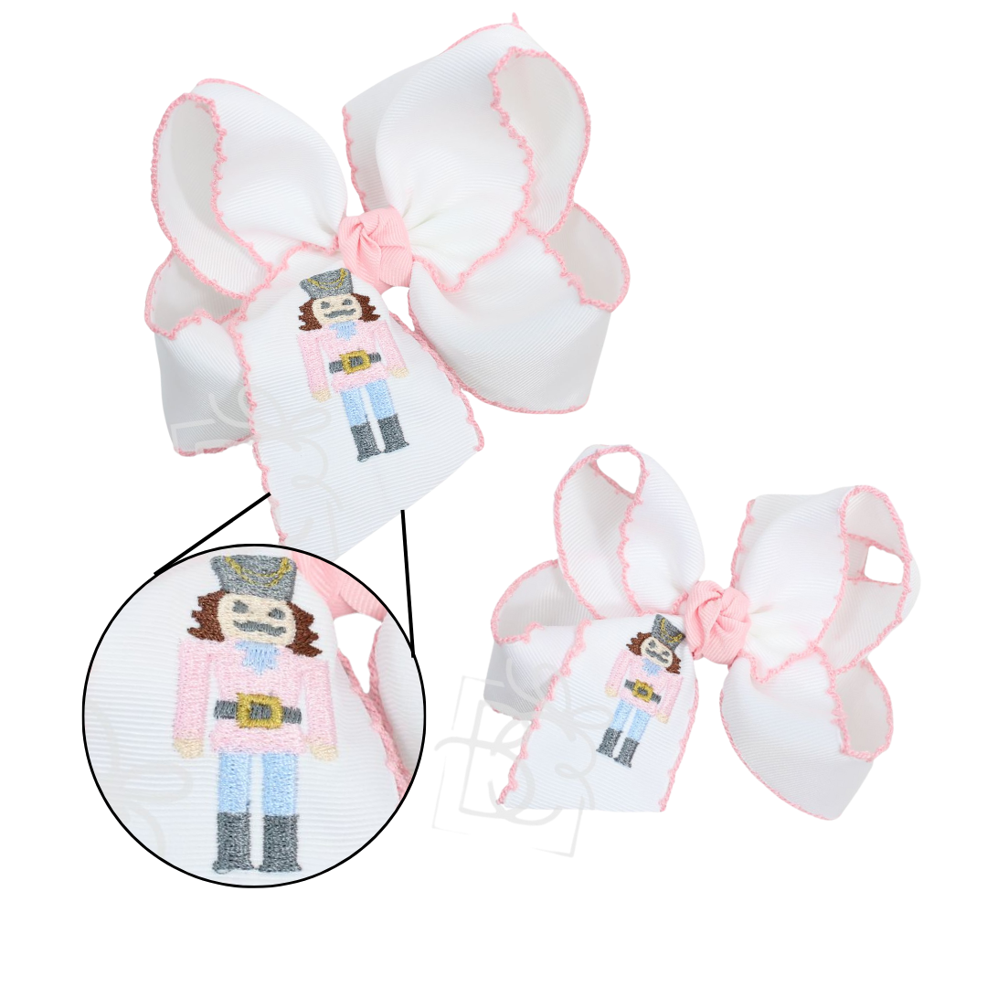 EMBROIDERED NUTCRACKER CROCHET EDGE BOWS